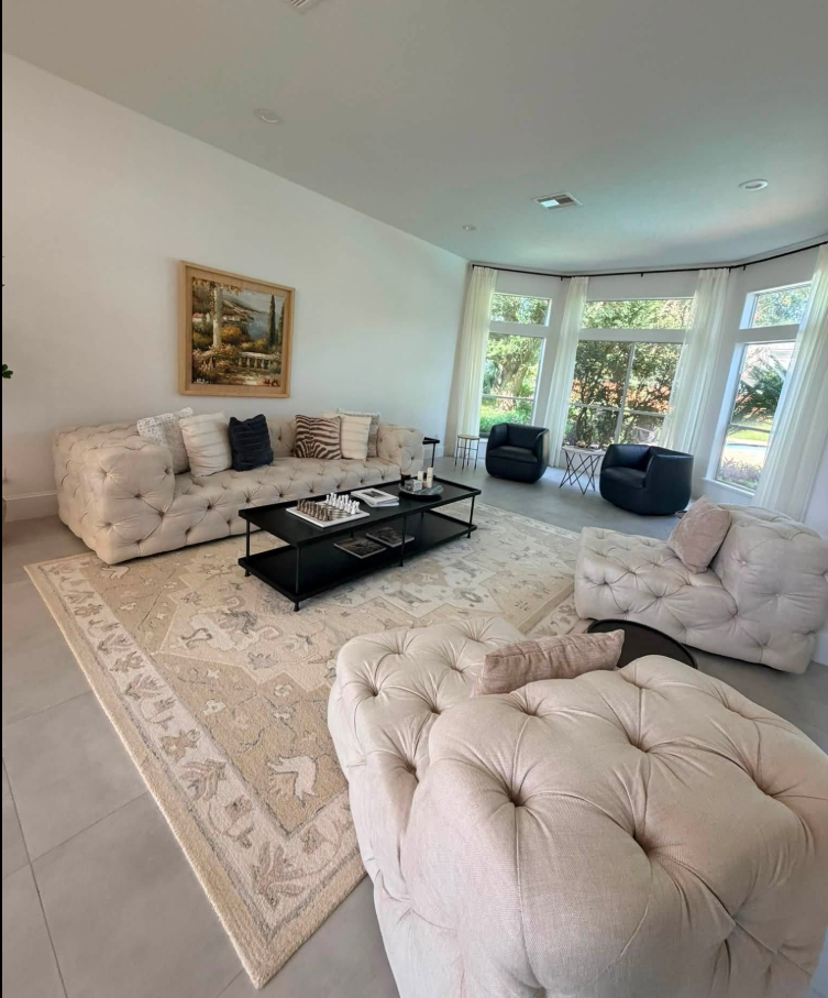 Bright living room with cleaned tile floors and upholstery in a Houston home